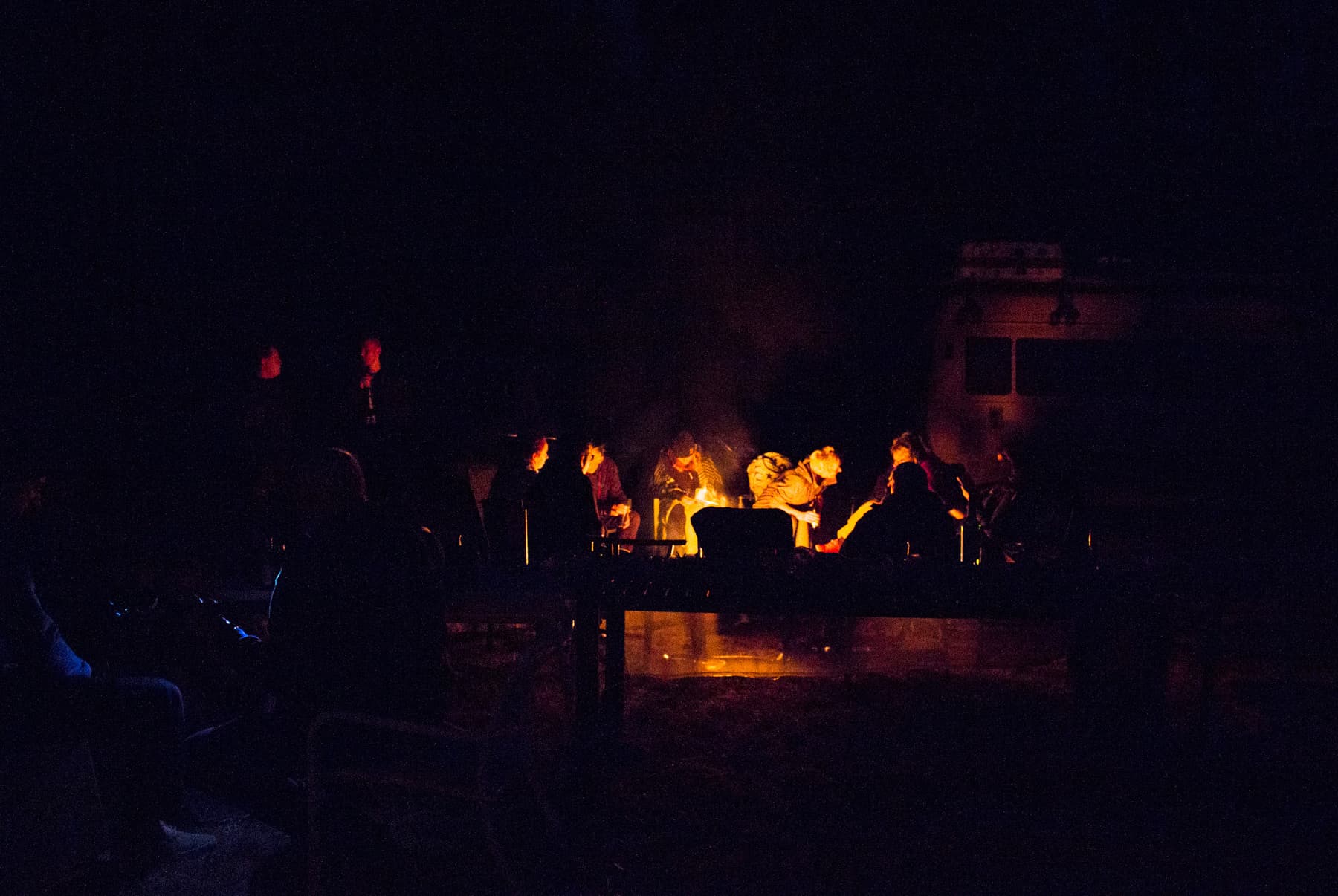 A group of people enjoying a campfire